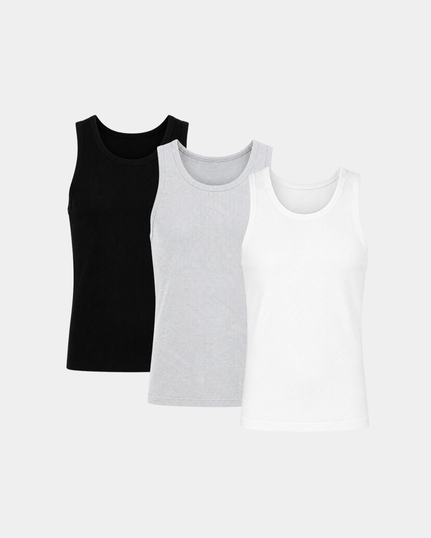 Three sleeveless tank tops in black, light gray, and white, arranged in a row on a light gray background.
